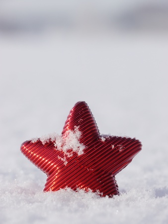 a red star in a winter landscapeの写真素材