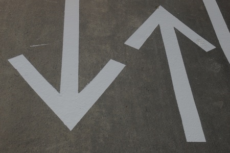 fresh arrows on a asphalt surface outsideの写真素材