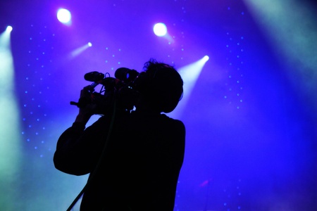 shillouette of a camera operator on an open-airの写真素材