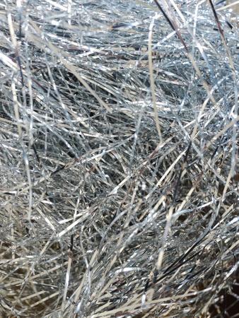 Silver Christmas tinsel background, closeupの写真素材