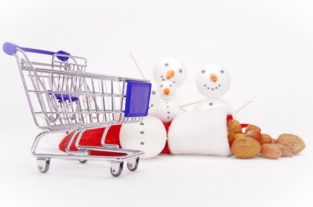 snowman shopping cart isolated on white backgroundの写真素材