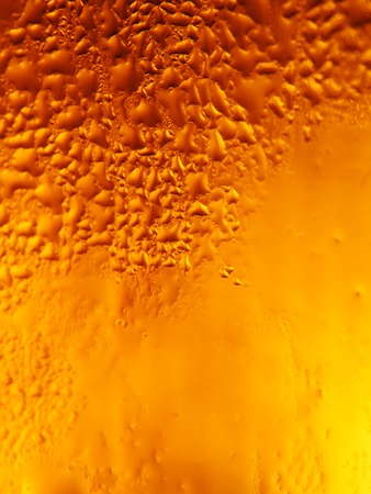 close up shot of a beer mug with drops on surface