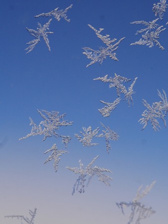 frost ice crystal on a window background patternの写真素材