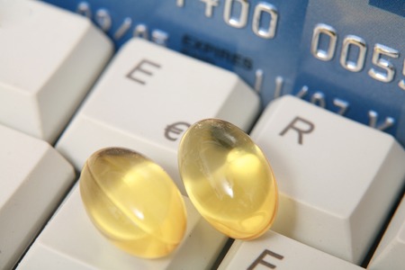 Close-up of some pills on a keyboard