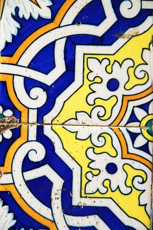 old tiles with ornament at a wall outsie