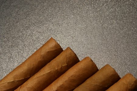 cigars in dramatic lighting.