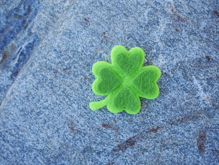 Green clover leaf with green hearts
