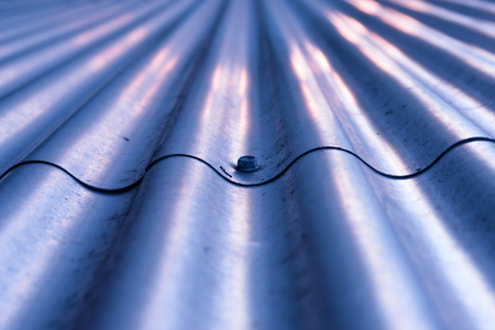 Close-up of a metalplate with wave pattern