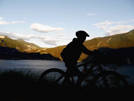 A silhouette of a mountain bikerの写真素材