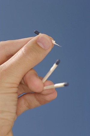 Hand holding matches.