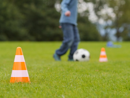 training soccer ball on a green fieldの写真素材