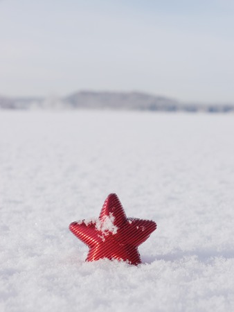 a red star in a winter landscapeの写真素材