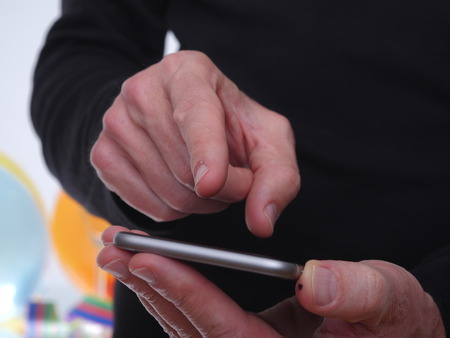 glasses of champagne and streamer on yellow backgroundの写真素材