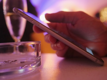 Man using a mobile phone in restaurant, cafe,bar