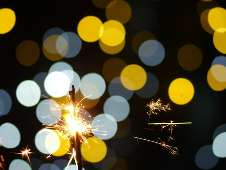 sparklers on new year&#39;s eve with bokeh backgroundの写真素材