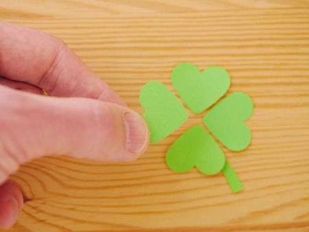 Green clover leaf with green hearts