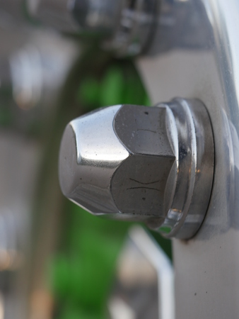 olts and nuts on a tireの写真素材