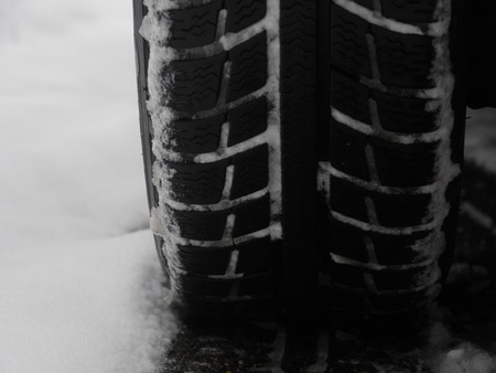 tires which leave tiretracks in the snowの写真素材