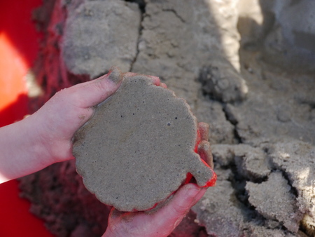 The Child game of sandbox. In frame only hands.