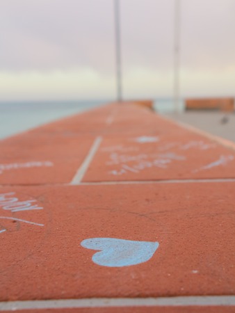 a drawed heart on asphaltの写真素材