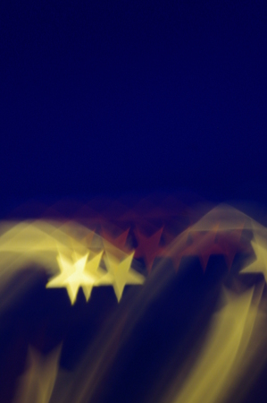 yellow stars bokeh as backgroundの写真素材