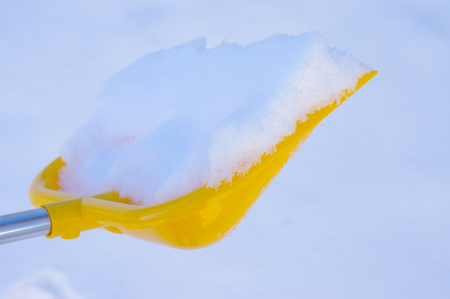 Snow Removal with shovel at winter coldの写真素材
