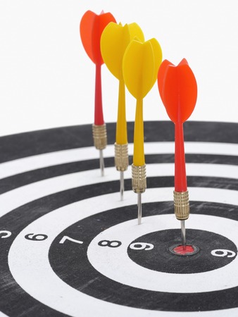 dart board with darts isolated on white