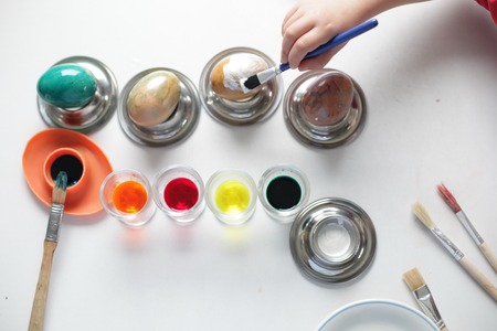 Easter eggs are painted with a brushの写真素材