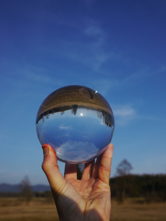 a bowl which is mirror inverted holding from someoneの写真素材