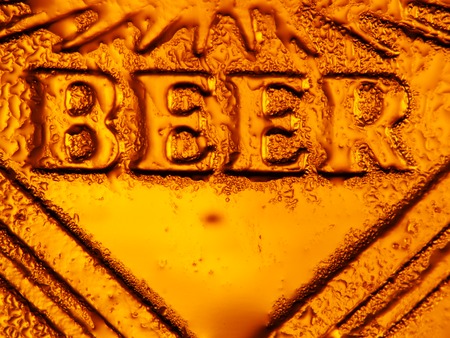 close up shot of a beer mug with drops on surfaceの写真素材