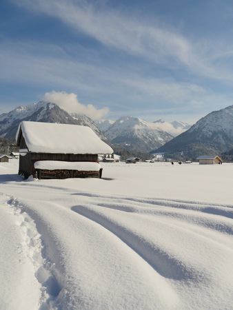 View on village in mountains in wintertimeの写真素材