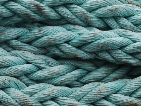 Closeup of blue coiled ropeの写真素材