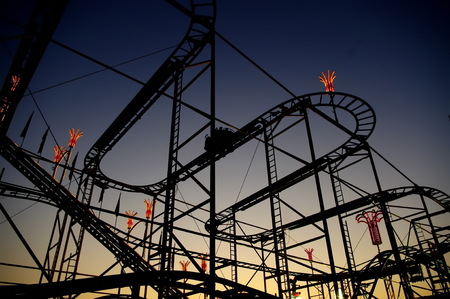 Panoramic shot of a roller coaster's loop at sunset.の写真素材