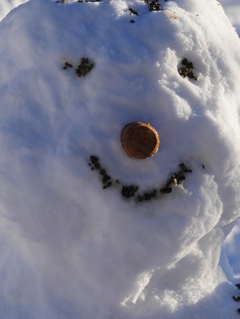 young toddler hand building snowmanの写真素材