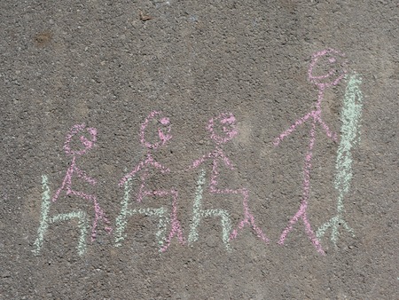 Close up of classroom with teacher standing near blackboard and pupils drawn on asphalt with colorful chalk.の写真素材