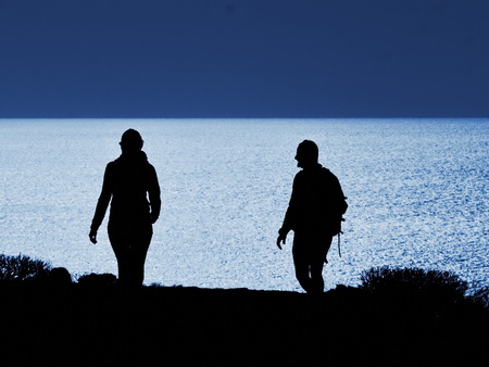 couple walking with a dog