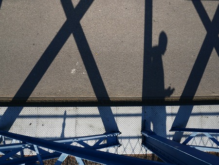 silhouette of one man use cellphone in the outsideの写真素材