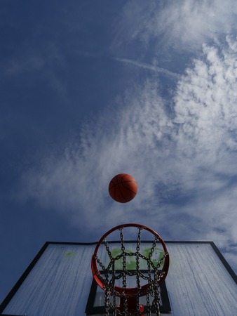 Basketball hoop on a blue sky.