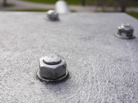 gray metal screws and nuts in the structureの写真素材