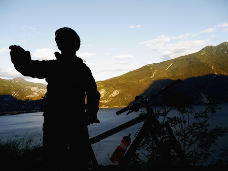 A silhouette of a mountain bikerの写真素材