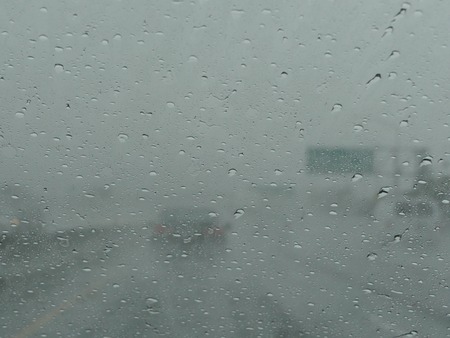 View on highway through wet window
