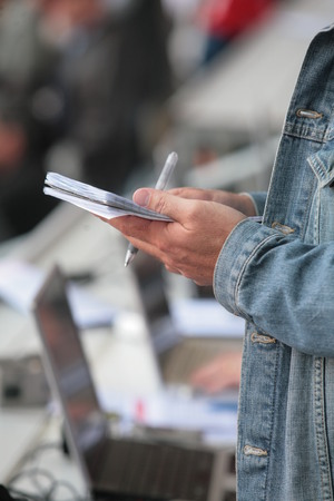 somebody write in his noticebookの写真素材