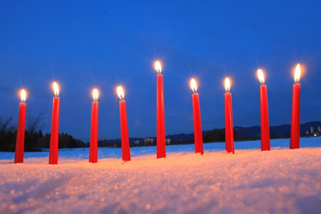 candles in the snow outdoorsの写真素材