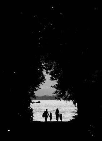 someone walking through way with treesの写真素材