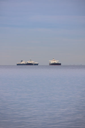 Two large ships are sailing in the oceanの写真素材