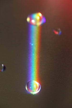 Rainbow is reflected in a puddle of waterの写真素材