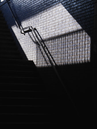 Staircase with a shadow cast on the wall