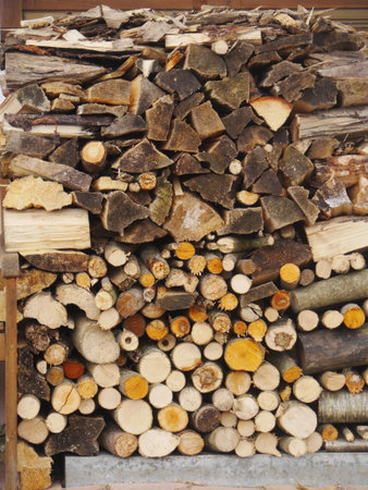 Pile of wood logs stacked on top of each other