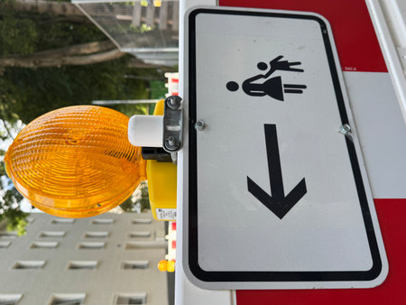 Caution Sign Featuring a Pedestrian Direction Indicator for Enhanced Safety Awareness