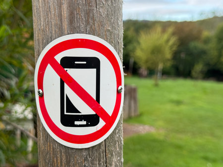 A Sign Indicating No Cell Phone Use in Beautiful Nature Surroundings and Sceneryの写真素材